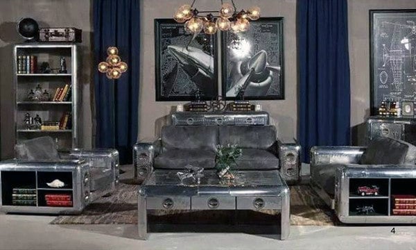 Industrial-themed living room with metallic furniture and spaceship artwork