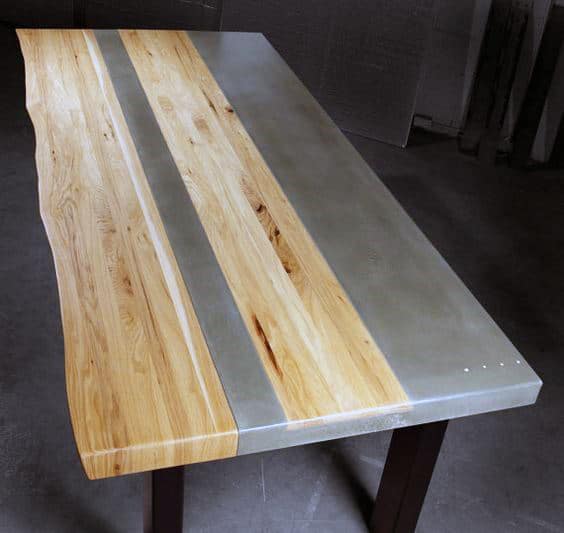 A wooden and metal dining table with a sleek, modern design