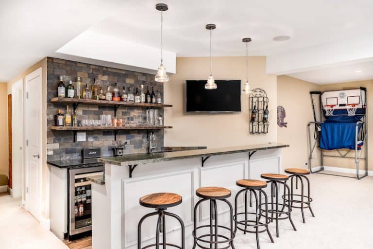 man cave with bard and basketball net