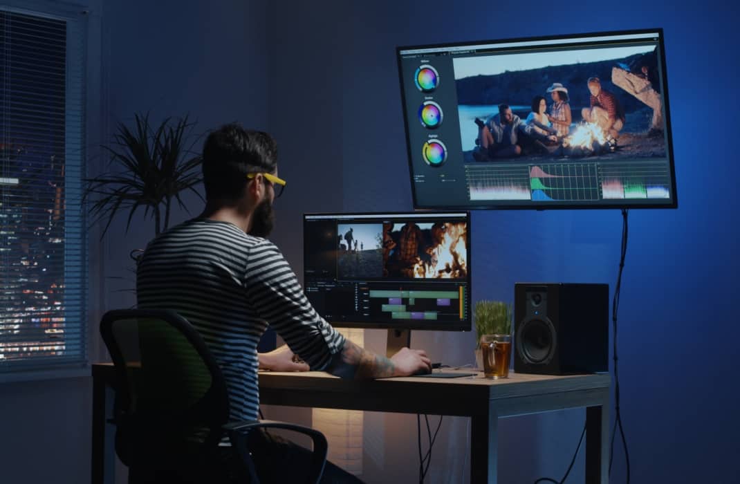 man edit videos in a studio