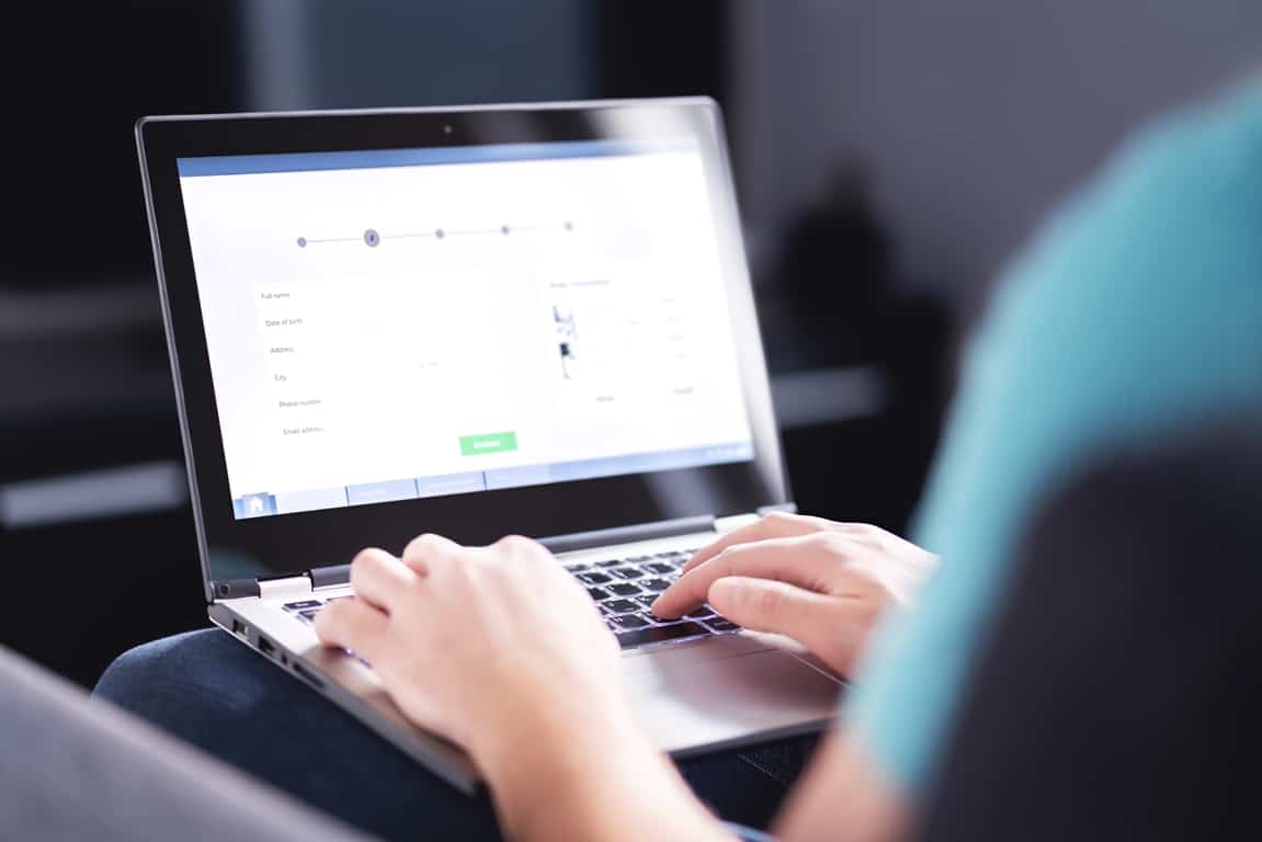 man fill up personal information on website