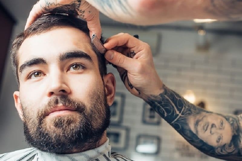 man having hair cut