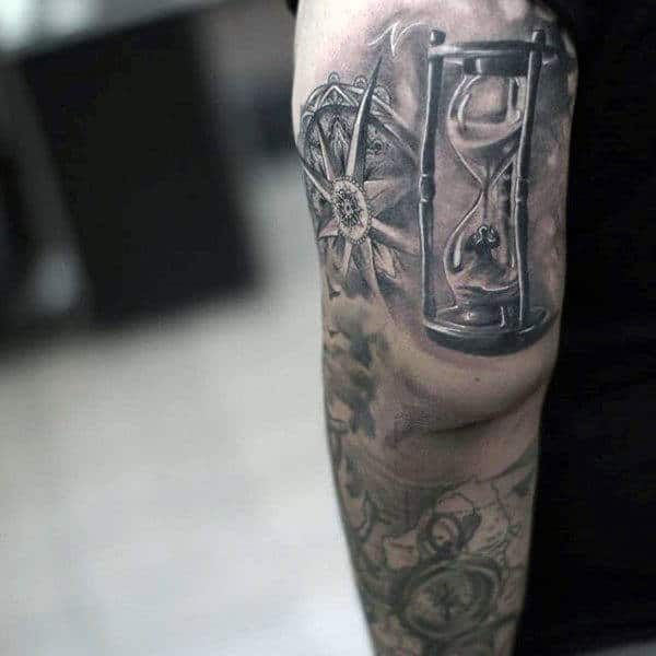 Man Inside Hourglass Tattoo Design On Back Of Arm