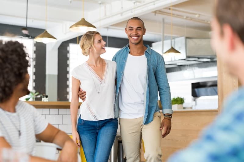 man introduce her girlfriend to his friends