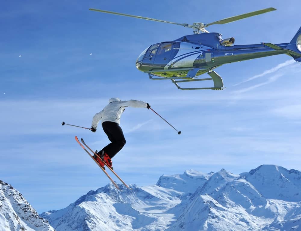 man jumbing high from a helicopter