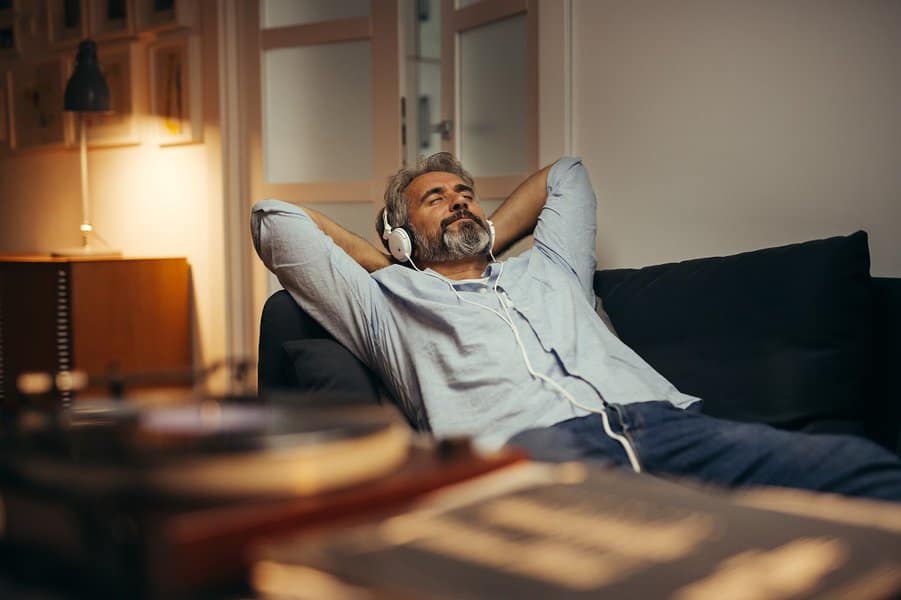 man listening music with headphones