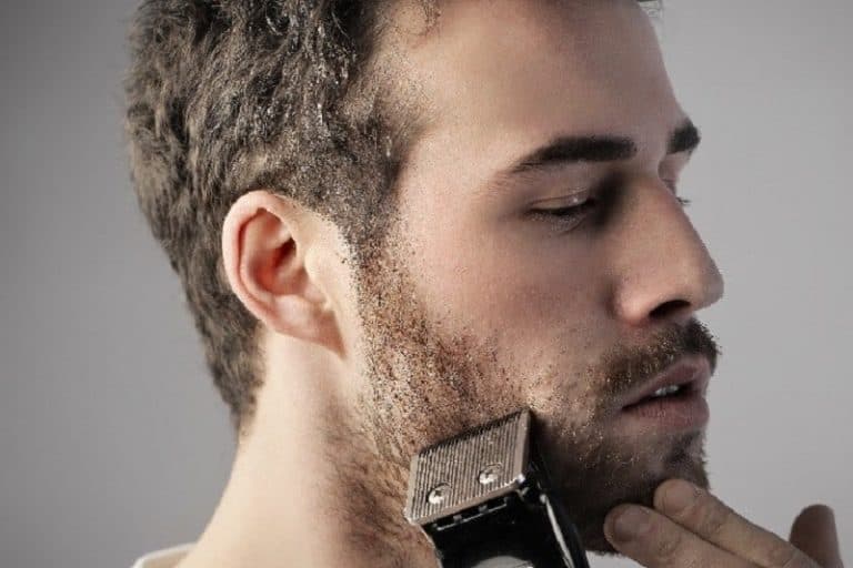 man shaving beard