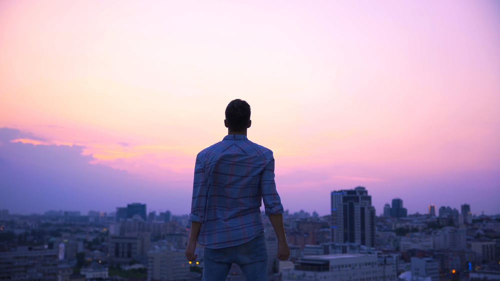 man standing on roof