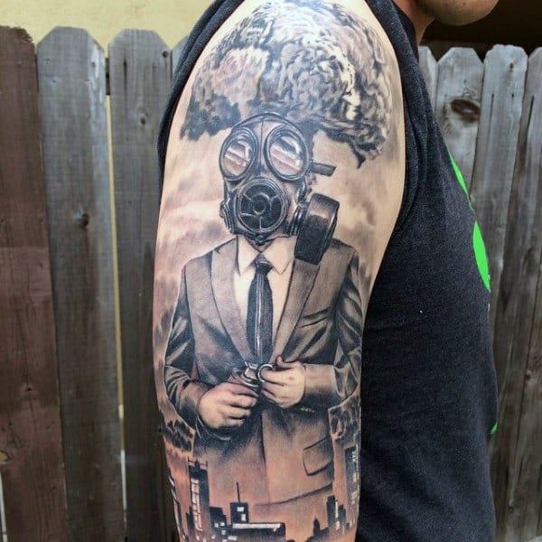 Man Wearing A Suit And Gas Mask Tattoo On Arm With Explosion