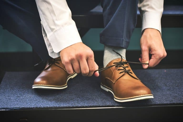 man wearing brown shoes