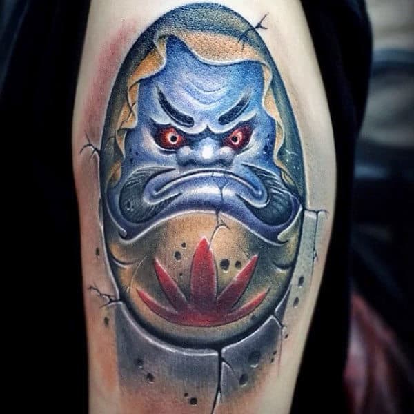 Man With 3d Daruma Doll Blue Ink Tattoo On Arm