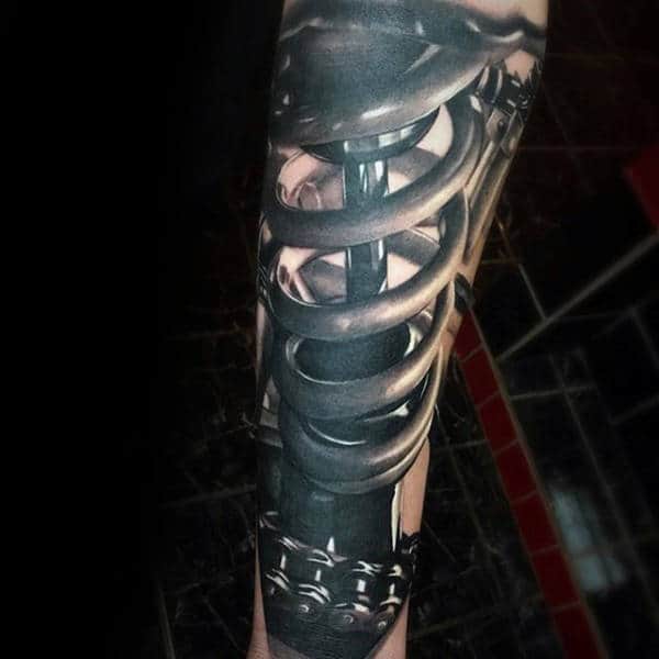 Man With 3d Realistic Motocross Shock Tattoo On Forearm