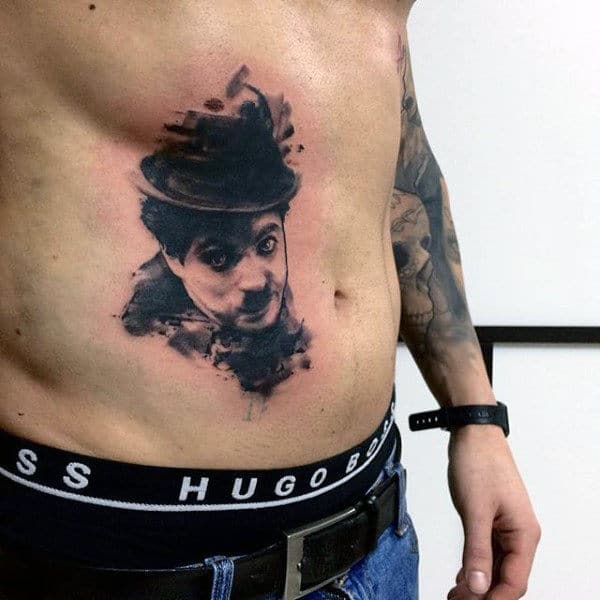 Man With A Hat Watercolor Tattoo On Torso For Guys