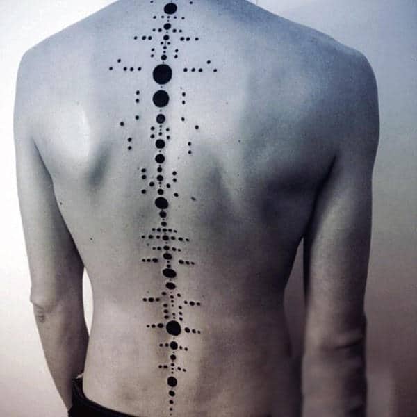 Person with geometric dot and line tattoo along spine on their back
