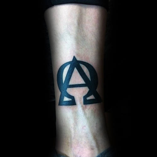 Man With Alpha Omega Symbol Tattoo On Inner Forearm
