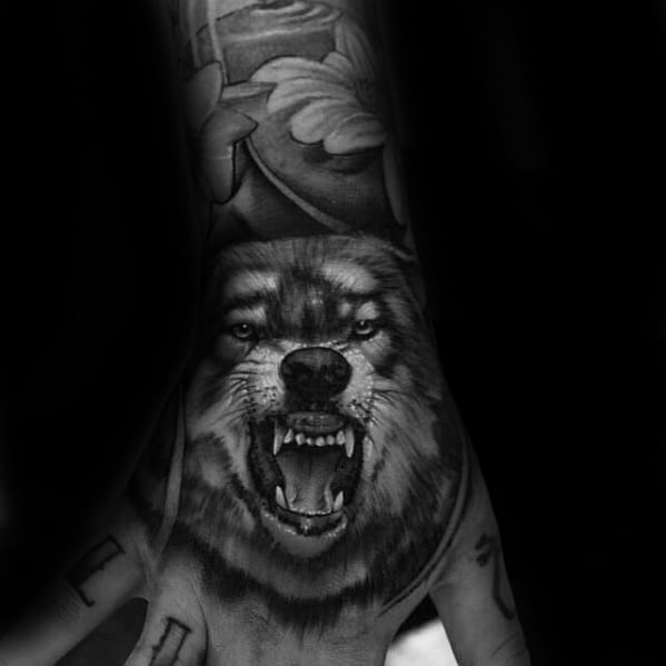 Man With Amazing Realistic 3d Tattoo Of Wolf On Hand