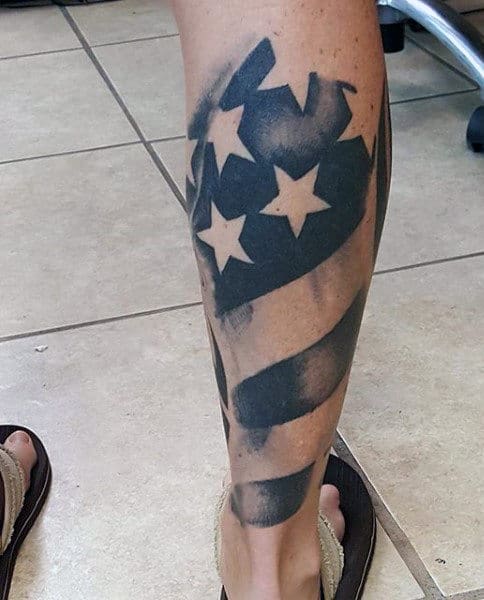 Man With American Flag Tattoo On Leg Calf