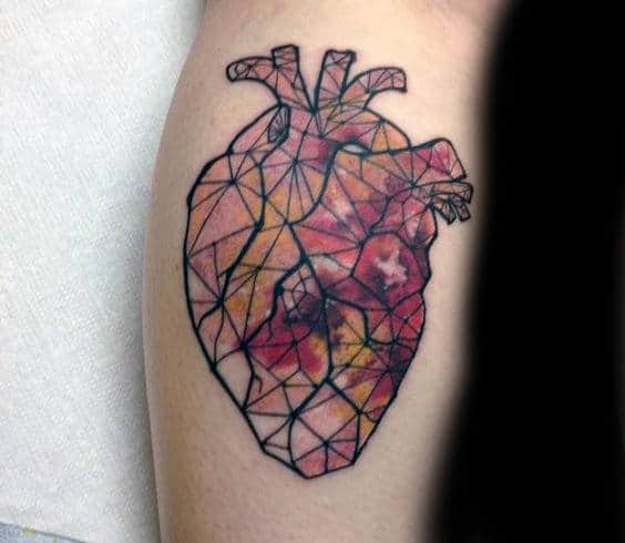 Man With Anatomical Heart Stained Glass Tattoo On Forearm
