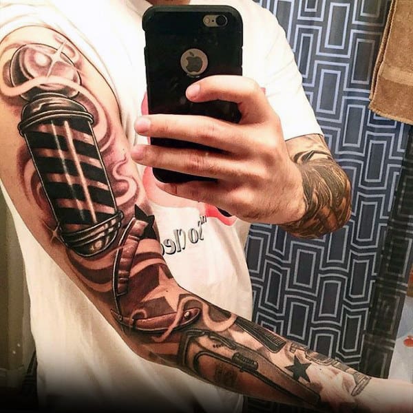 Man With Awesome Straight Razor Tattoo On Full Sleeves