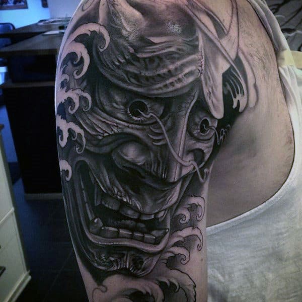 Man With Awesome Tattoos Of Japanese Samurai Mask Half Sleeve With Black And Grey Ink