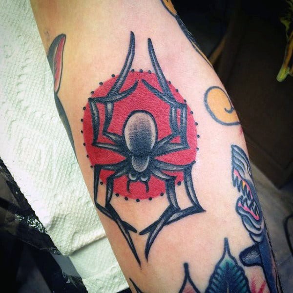 Man With Aztec Spider Tattoo On Legs