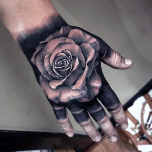 Man With Badass Black Ink Background And White Rose Hand Tattoo