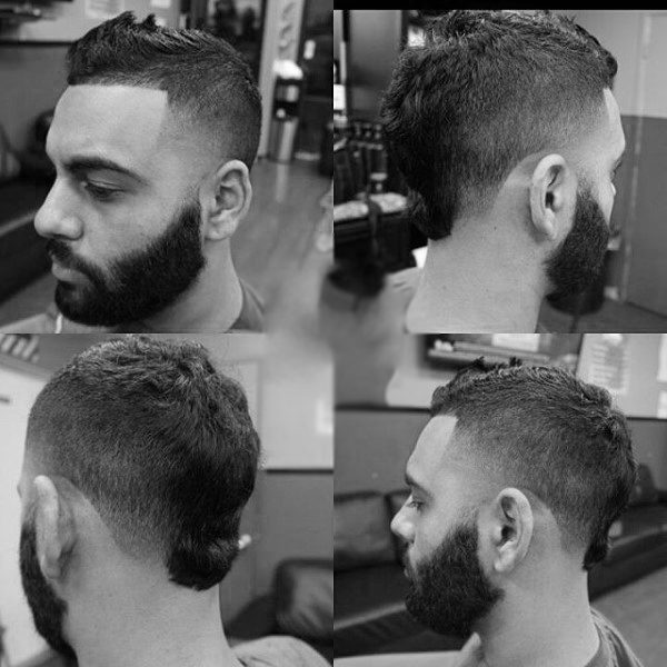 Man With Beard And Faux Hawk Fade Haircut