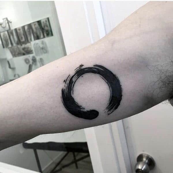 Man With Bicep Tattoo Of Circle Watercolor Design