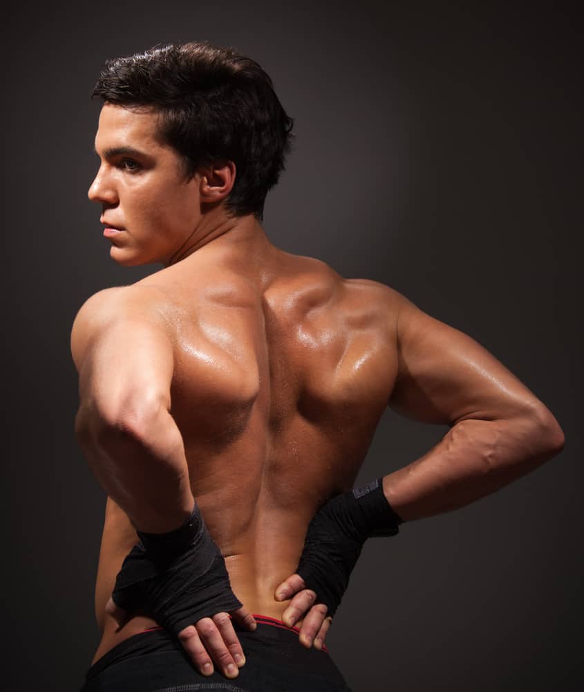 young man back with big mussels