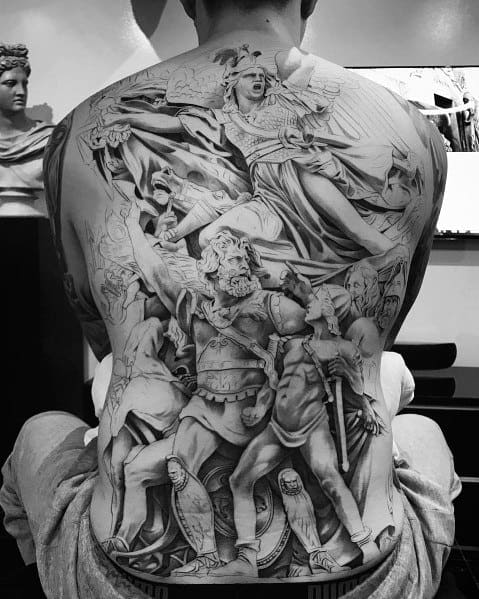 Black and grey full-back tattoo featuring a dramatic battle scene with warriors, mythological figures, and intricate shading for a powerful and detailed design.