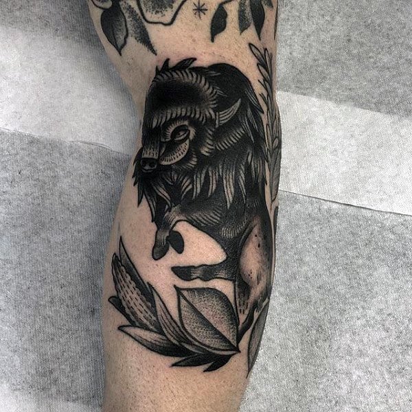 Man With Black Ink Bison Arm Tattoo