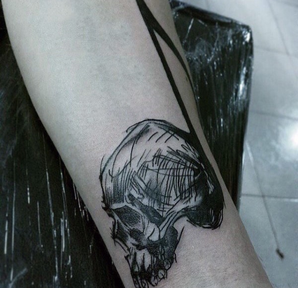 Man With Black Musical Note Pencil Sketch Tattoo On Wrist