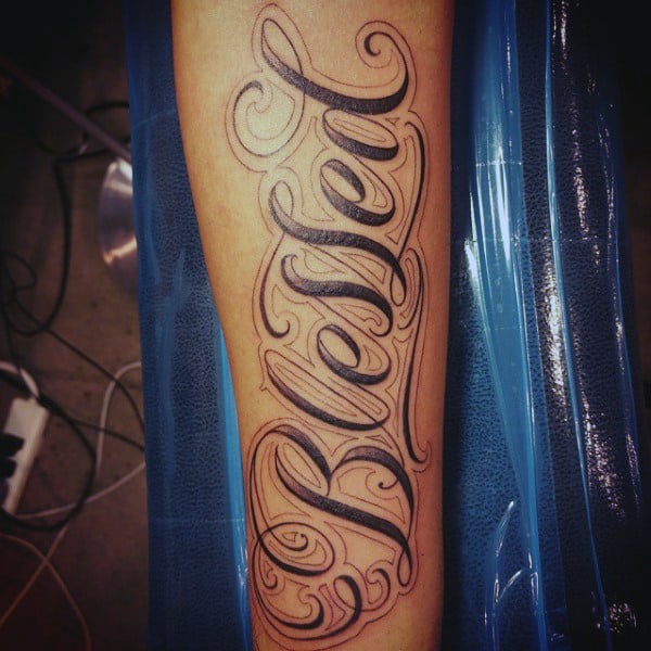 Man With Blessed Tattoo On Forearm