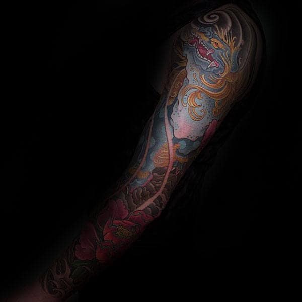 Man With Blue Foo Dog Full Sleeve Tattoo Design