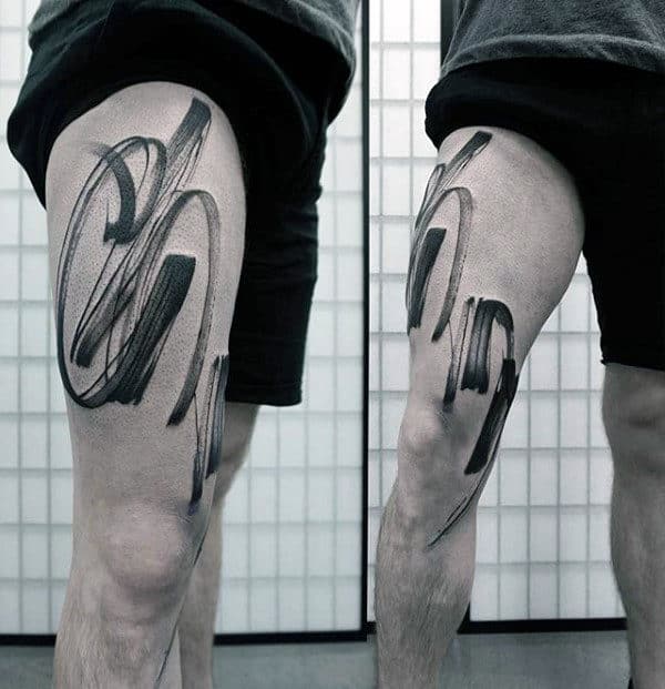 Man With Brush Stroke Thigh Tattoo