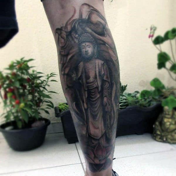 Man With Calm Buddha Tattoo On Lower Legs