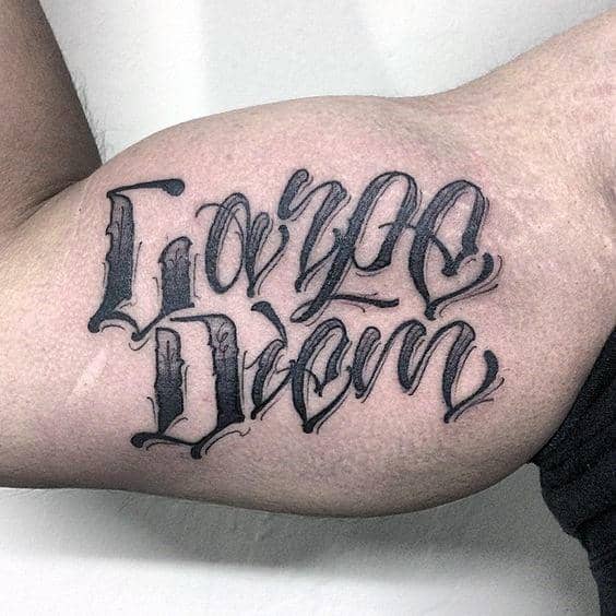 Man With Carpe Diem Bicep Tattoo