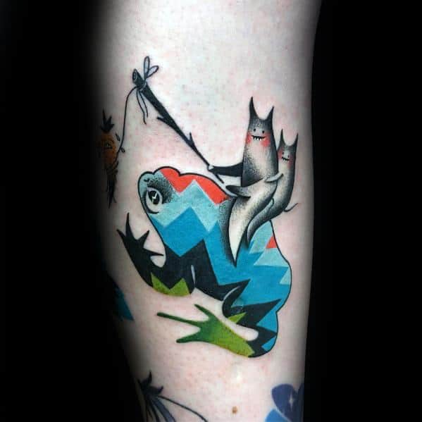 Colorful and abstract frog tattoo with geometric patterns, featuring playful fox-like creatures riding on its back for a whimsical and artistic design.