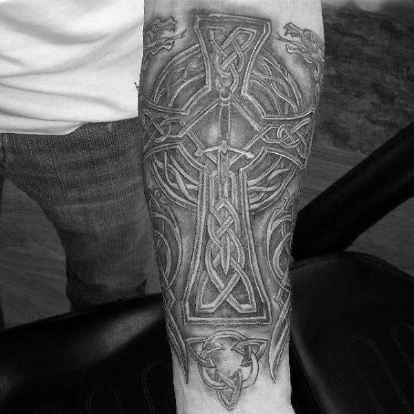 Man With Celtic Cross Forearm Sleeve Tattoo