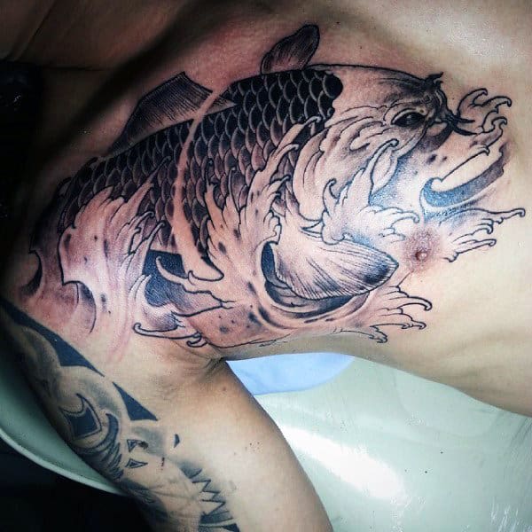 Man With Chest And Shoulder Wave Tattoos