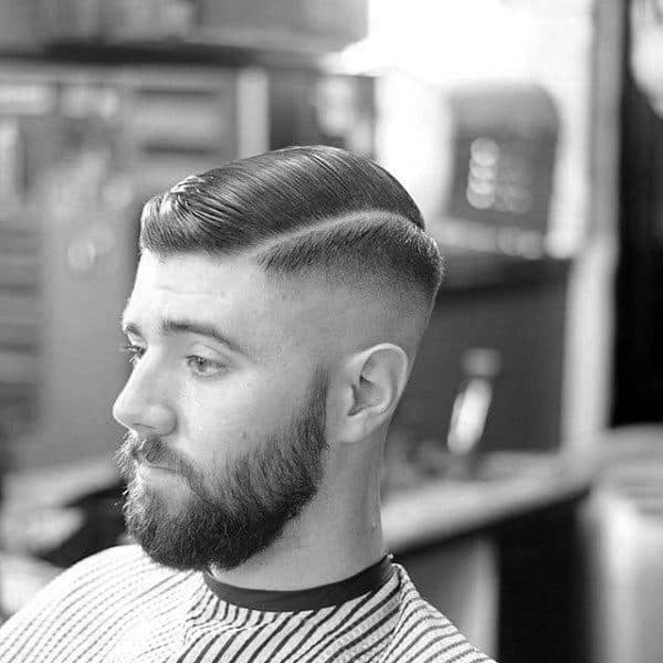 Man With Classic Old School Comb Over Haircut And Skin Fade On Sides Short Length