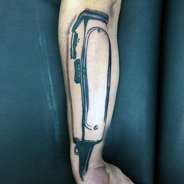 Man With Clipper Barber Tattoo On Inner Forearm