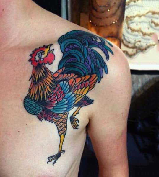 Man With Colorful Rooster Tattoo On Shoulder In Neo Traditional Style