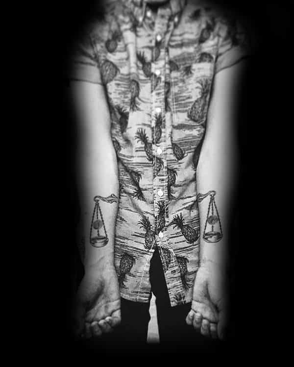 Man With Cool Libra Forearm Tattoos