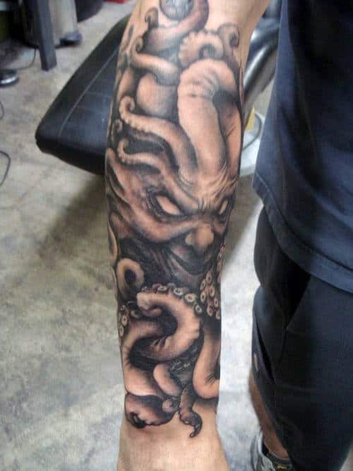 Man With Cthulhu Forearm Sleeve Tattoo Shaded Black And Grey Ink Design