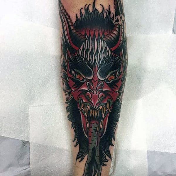 Man With Demon Shin Tattoo