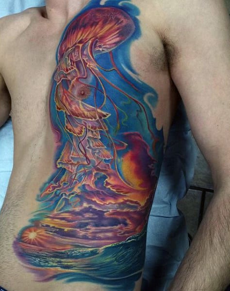 Man With Dramatic Color Side And Chest Sunset Ocean Tattoo