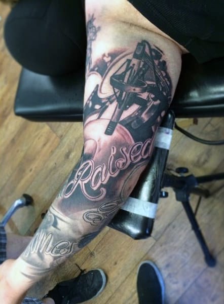 Man With Drum Sleeve Tattoo On Arm