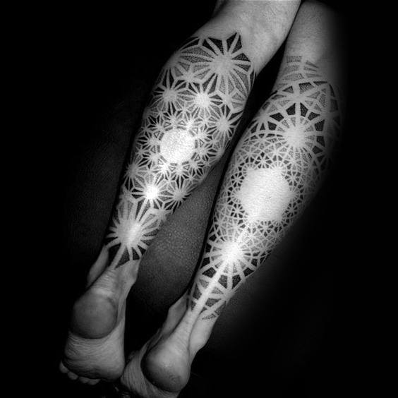 Man With Factal Sleeve Tattoos On Back Of Legs