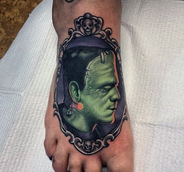 Man With Frankenstein Frame Foot Tattoo